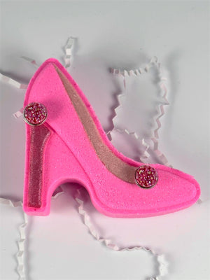 Pink high heeled shoe bath bomb with added pink druzy earrings to wear after your bath.