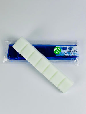 A white snap bar of our famed melt truffles of cocoa butter to be used for the bath or shower. Blue Nile has jasmine and lily of the valley wrapped together with a hint of vanilla bean. Presented in a colorful foil these truffles are waiting for you!