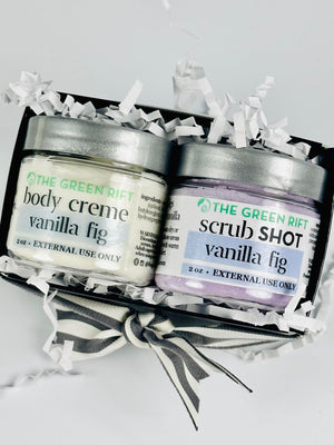 Mini Spa gift set with body creme and sugar scrub scented in Vanilla Fig. Imagine winter figs candied and paired with dar bourbon vanilla. Min gift box is black with white crinkle, shrinkwrapped and adorned with a white/grey ribbon..